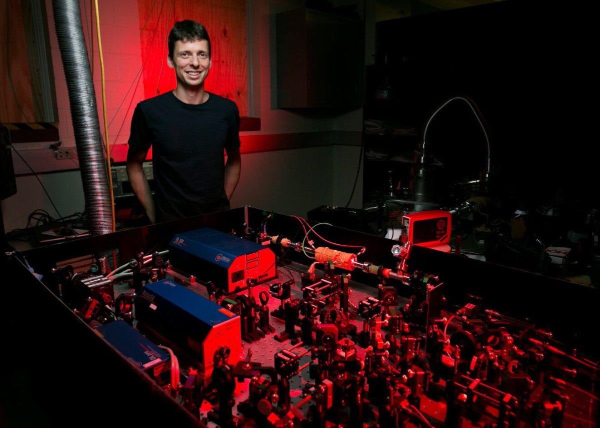 A professor standing in the laser lab